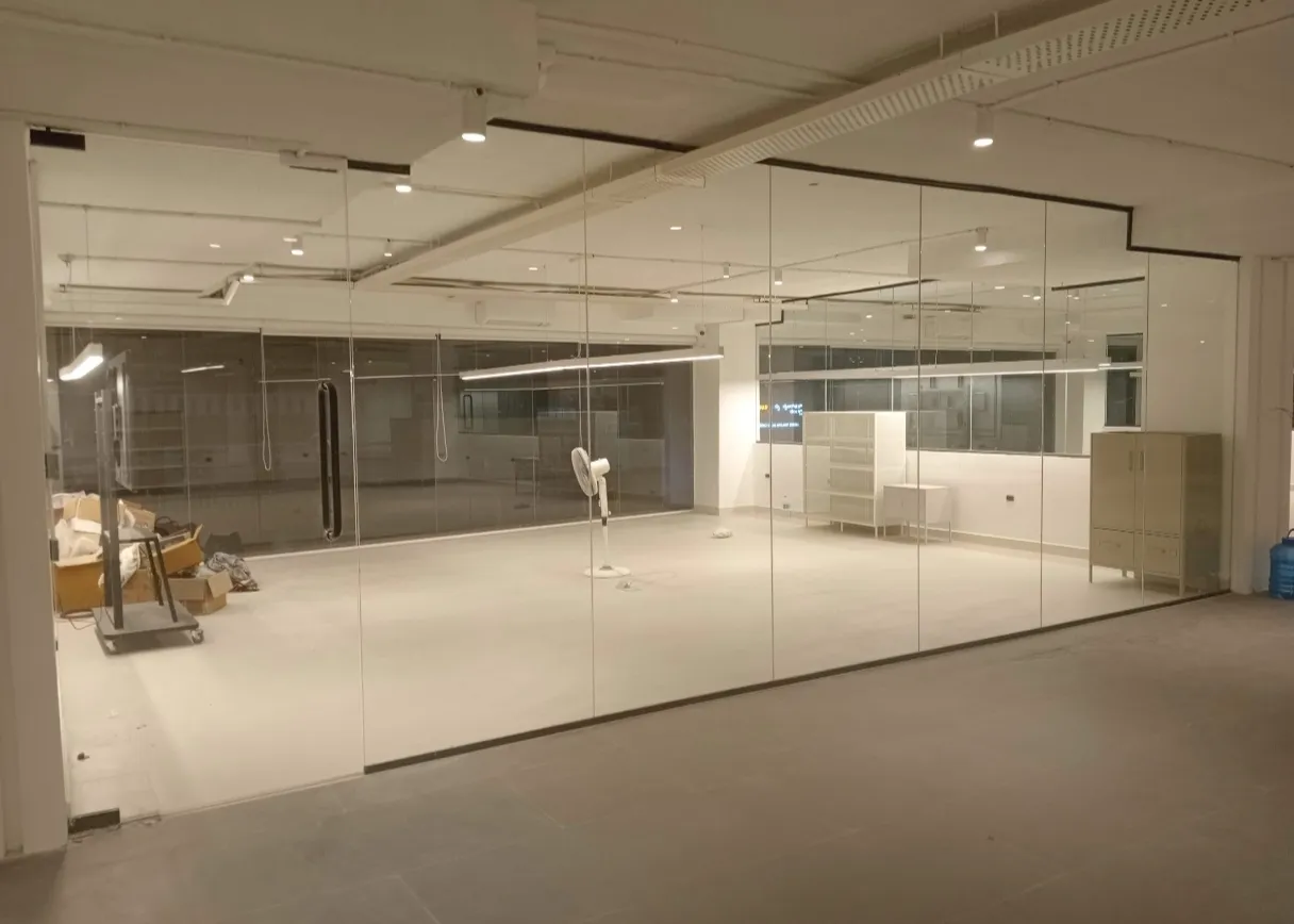 Frameless glass shop front installation for commercial retail space in Bangalore